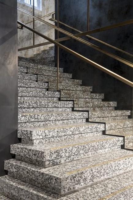 Seamless Bealstone floor with visible crystal aggregates, highlighting its modern terrazzo-style finish.