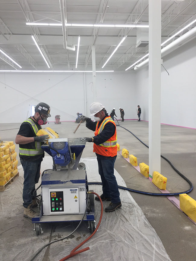 Construction professional applying self-leveling mortar, highlighting the ease of application for a durable finish.