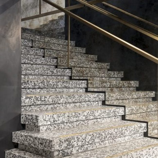 Seamless Bealstone floor with visible crystal aggregates, highlighting its modern terrazzo-style finish.