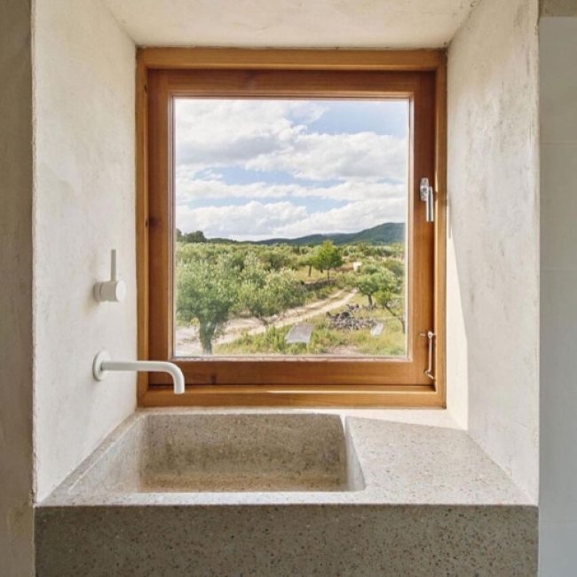Bealstone-coated bathroom vanity, showcasing its customizable color and unique mineral appearance in a high-end setting.
