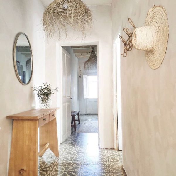 Kalklitir lime paint on a subtly textured wall in earthy tones, creating a warm, natural ambiance.
