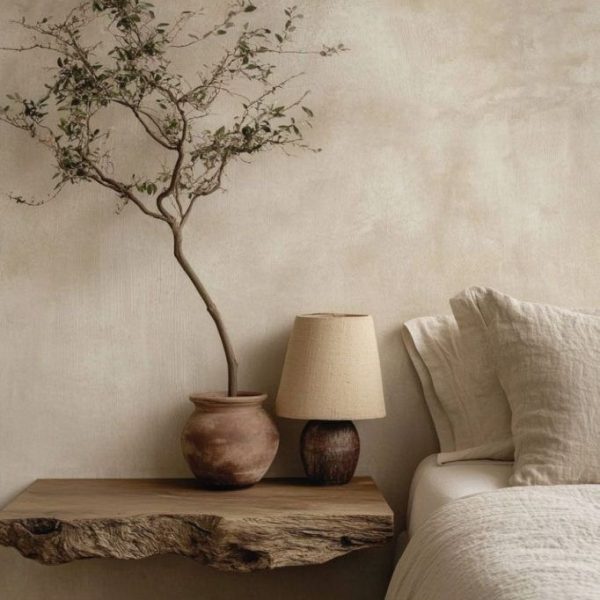 Kalklitir lime paint on a subtly textured wall in earthy tones, creating a warm, natural ambiance.