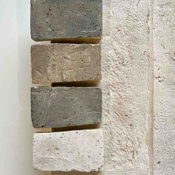 Close-up texture of lime mortar on a construction surface.