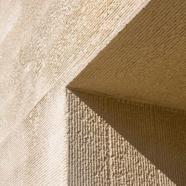 Natural lime mortar applied to a building exterior.