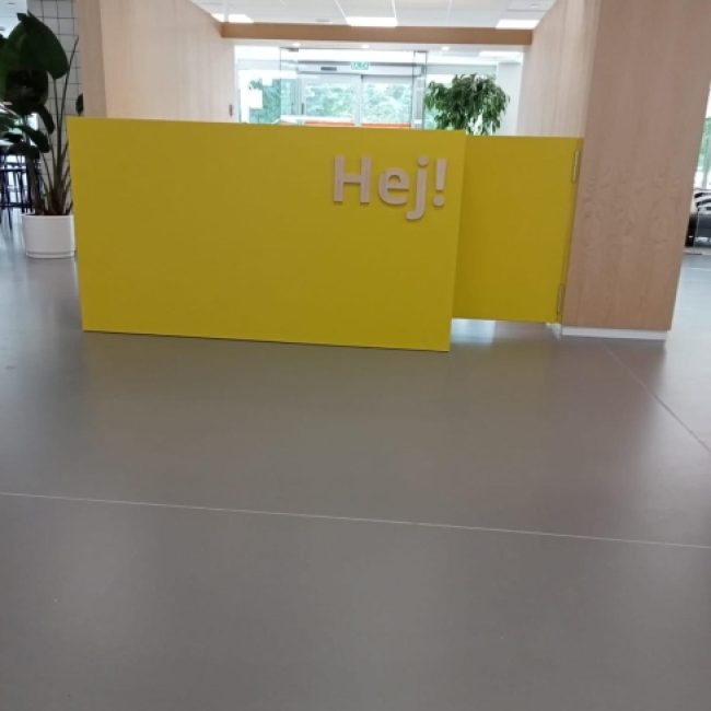 Seamless epoxy resin floor in a high-traffic industrial facility, showcasing its durability.