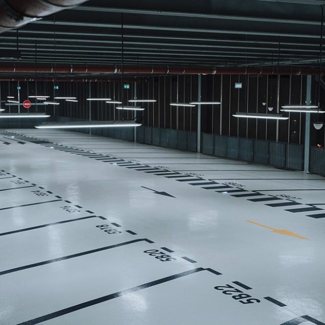 Seamless self-leveling floor creating a perfectly smooth, uniform base in a large interior space.