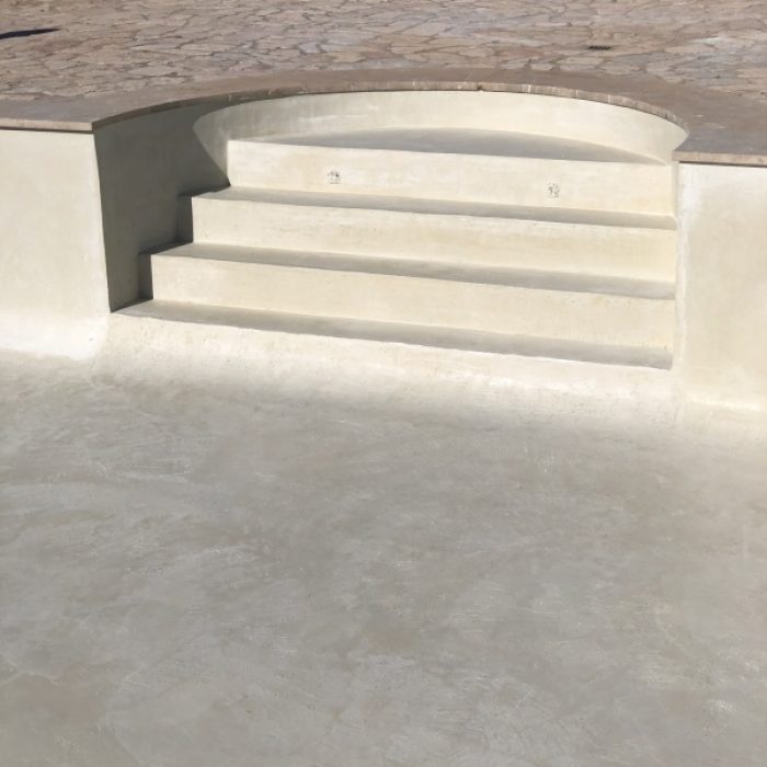 Semicircular built-in steps with smooth, rounded edges coated in premium Marblepool mineral finish.
